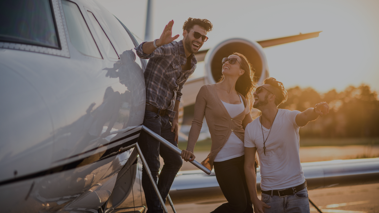Family boarding a private jet during school holidays